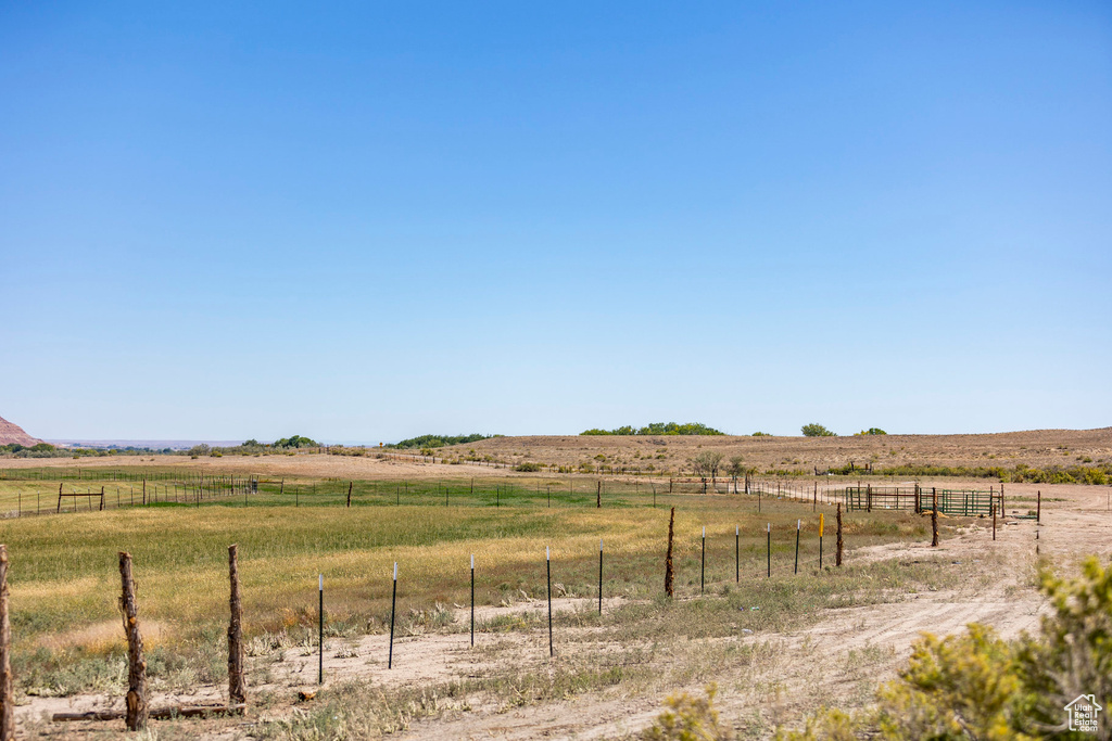 View of yard with a rural view