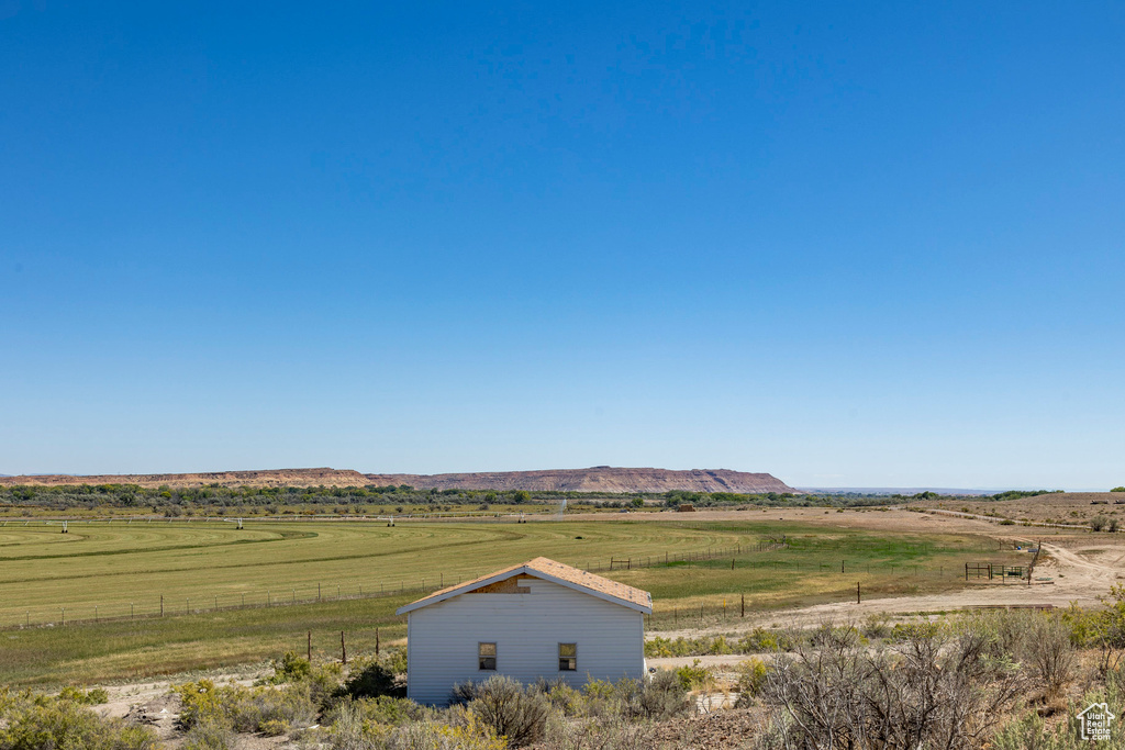 Property view of mountains with a rural view