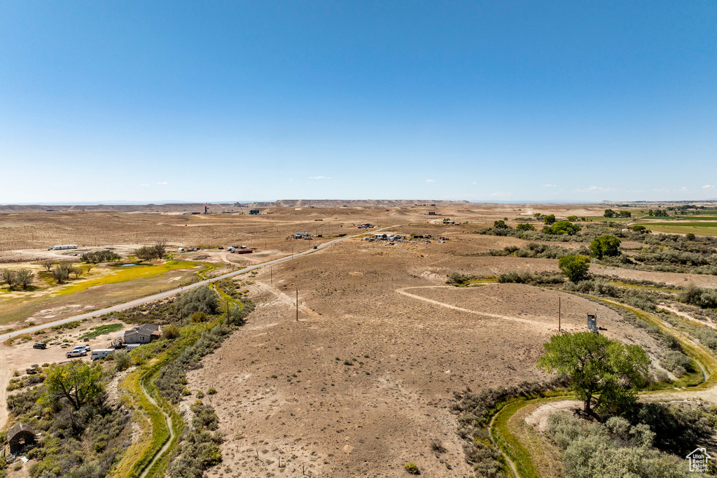 Birds eye view of property with a rural view