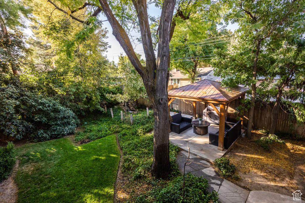 View of yard featuring a gazebo, a patio area, and an outdoor living space