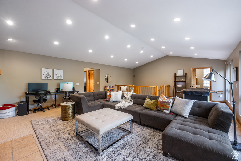 Living room featuring light carpet and lofted ceiling