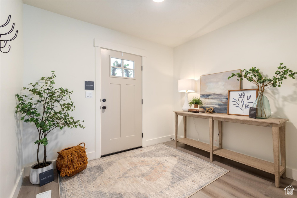 Foyer with hardwood / wood-style flooring