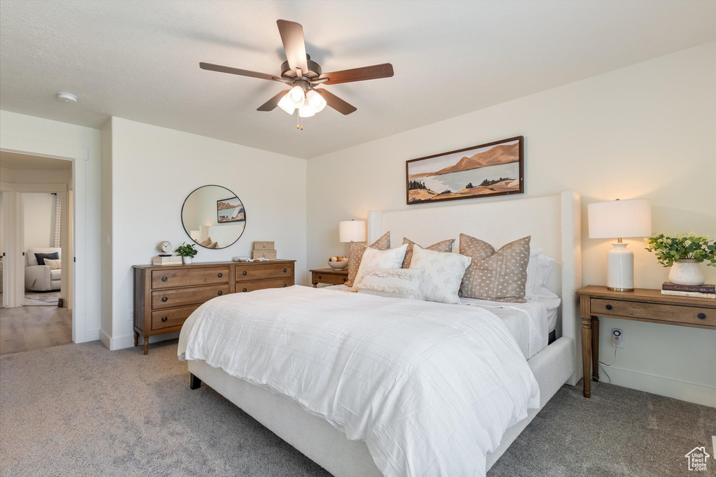 Bedroom featuring carpet and ceiling fan