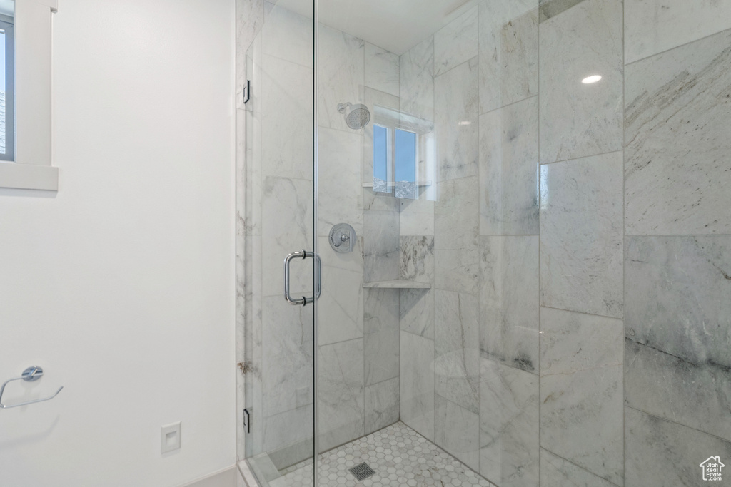 Bathroom featuring a shower with shower door