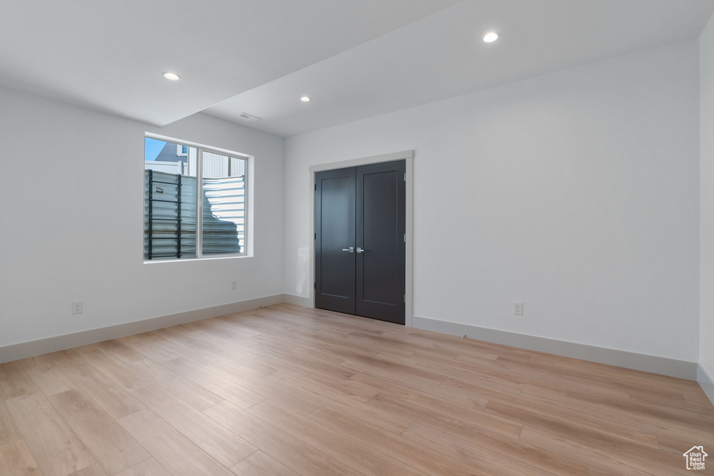 Unfurnished bedroom with light hardwood / wood-style floors