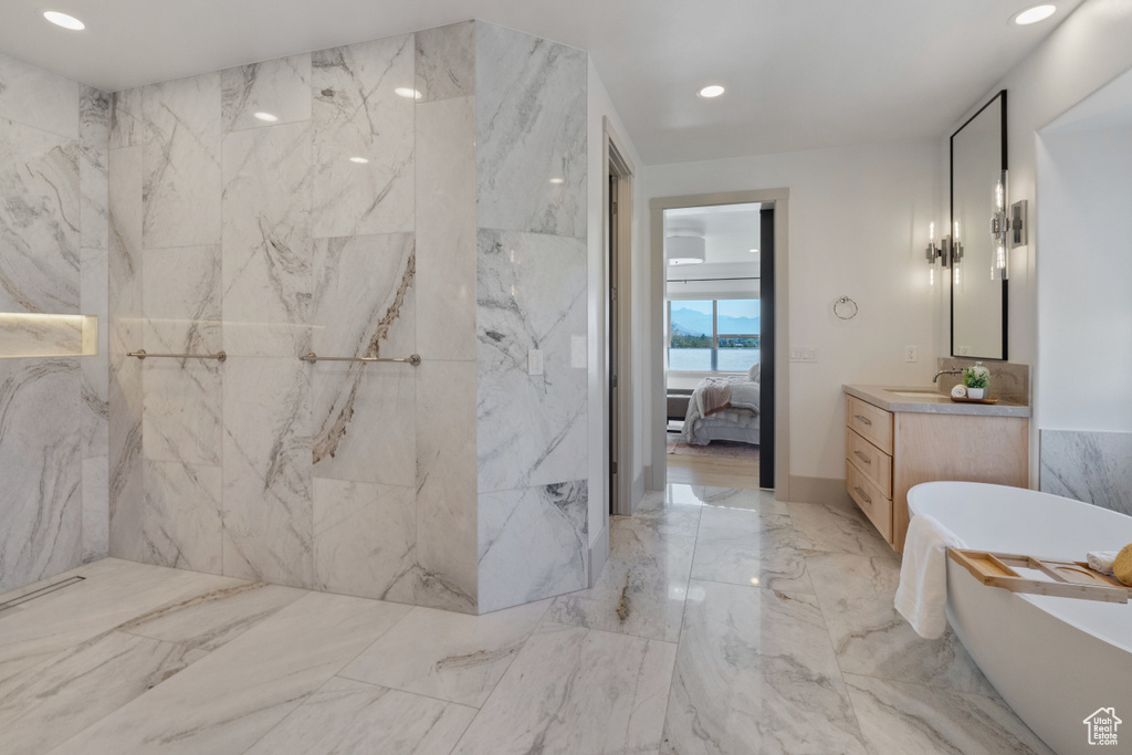 Bathroom with a bathing tub and vanity