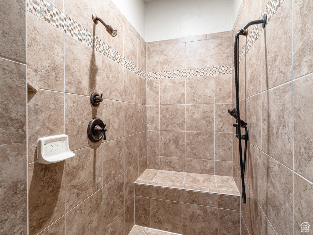 Full bathroom with a tile shower
