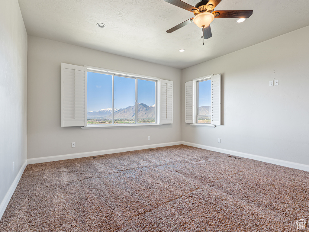 Spare room with visible vents, recessed lighting, ceiling fan, carpet floors, and baseboards