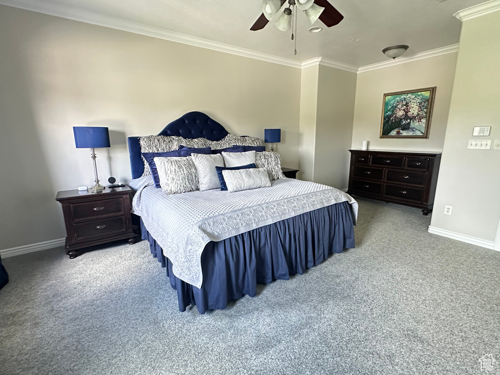 Bedroom featuring carpet, ornamental molding, baseboards, and ceiling fan