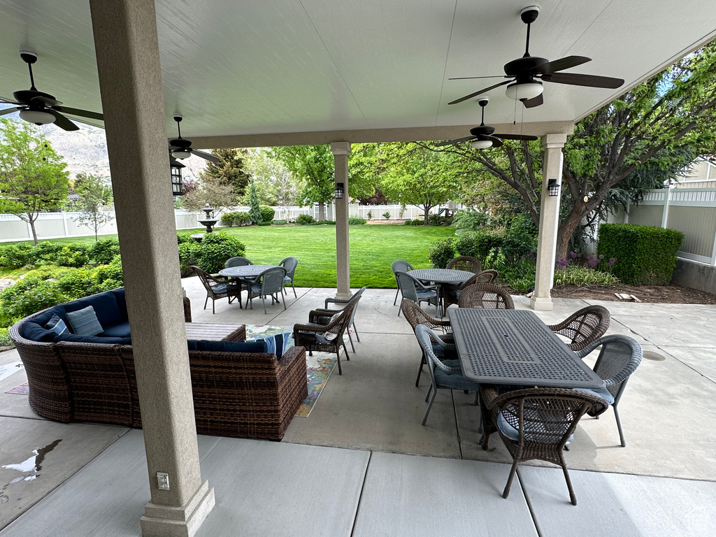View of patio with ceiling fan, outdoor dining space, and an outdoor living space
