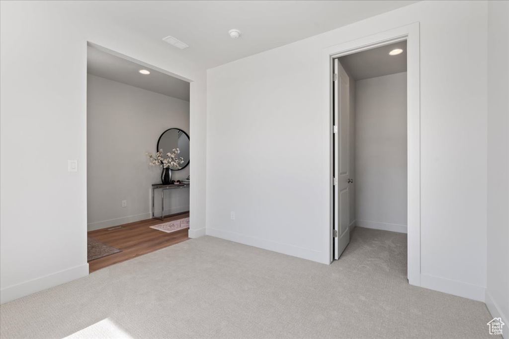 Interior space featuring light colored carpet