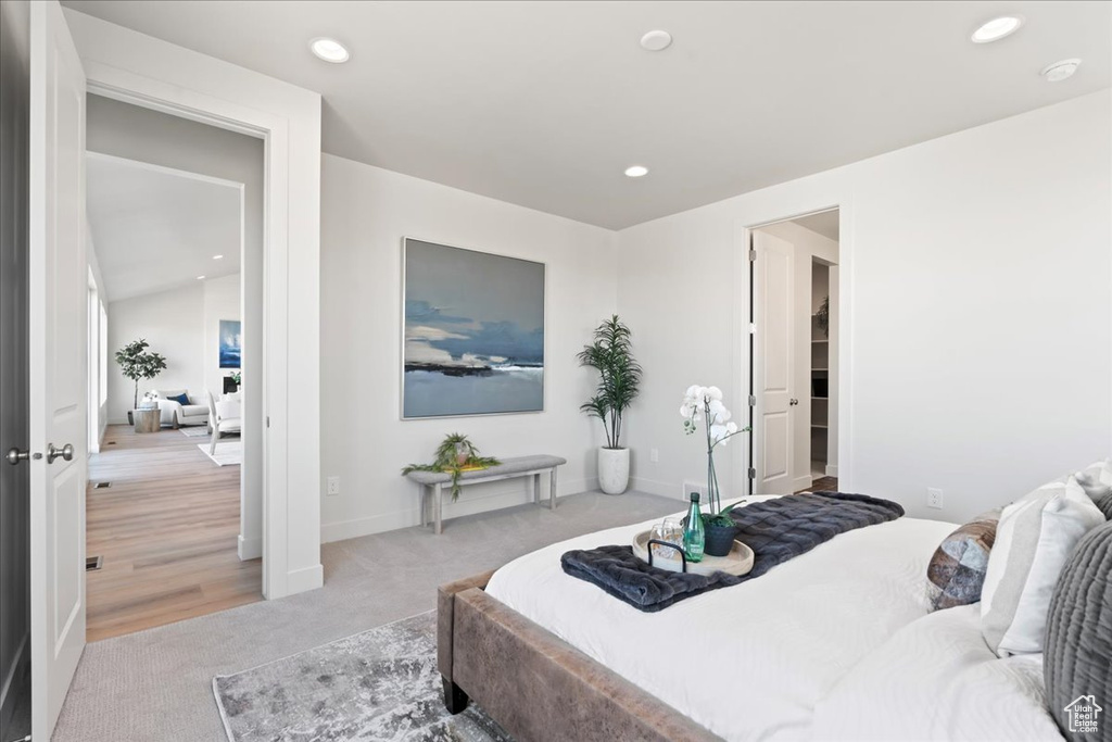 Bedroom with light colored carpet