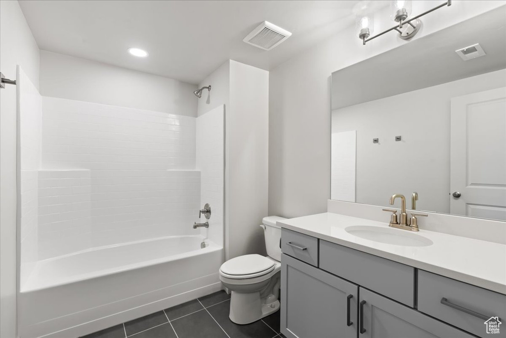 Full bathroom featuring tile patterned floors, bathing tub / shower combination, vanity, and toilet