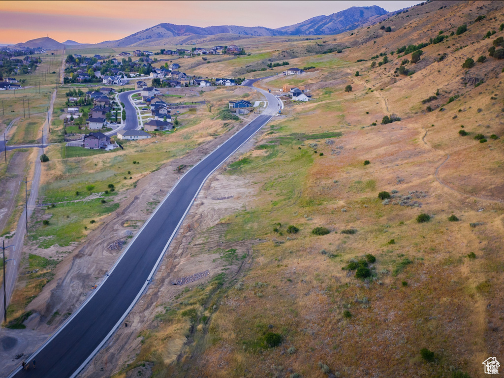 Aerial view at dusk featuring a mountain view