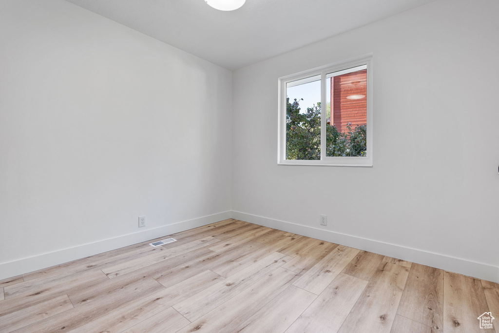 Empty room with light wood-type flooring