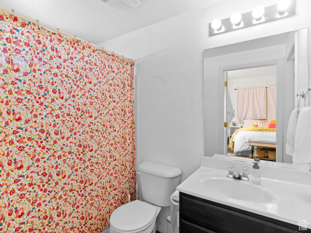 Bathroom with vanity and toilet