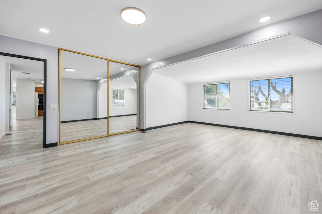 Unfurnished room with light hardwood / wood-style floors