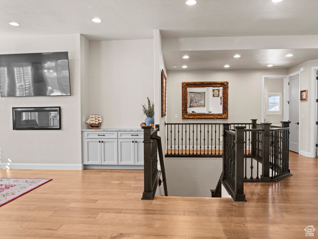 Hallway featuring light hardwood / wood-style flooring