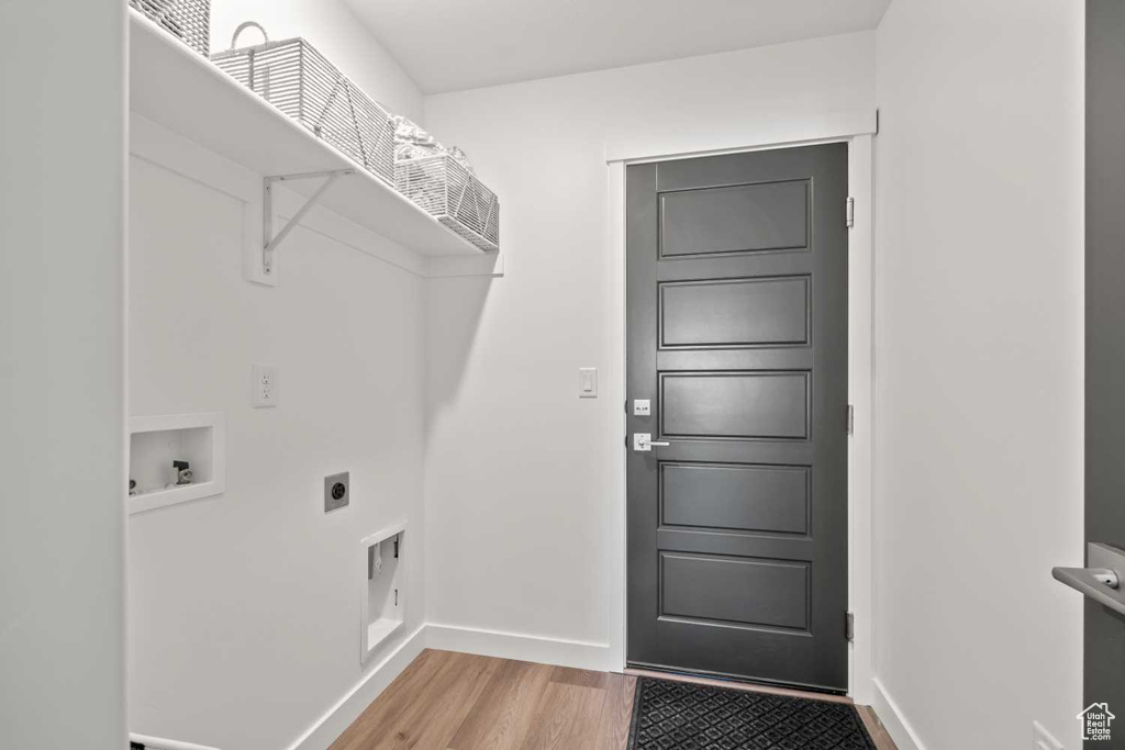 Washroom with washer hookup, electric dryer hookup, and hardwood / wood-style flooring