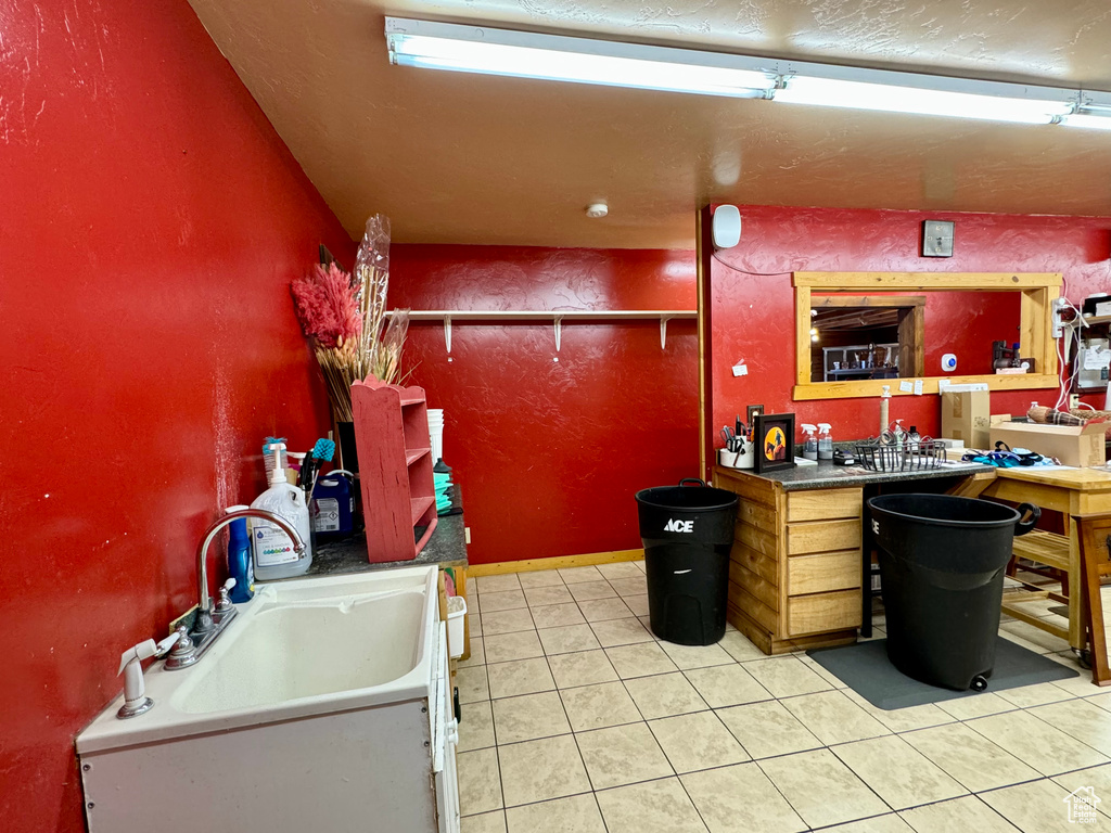 Kitchen featuring sink and tile patterned floors