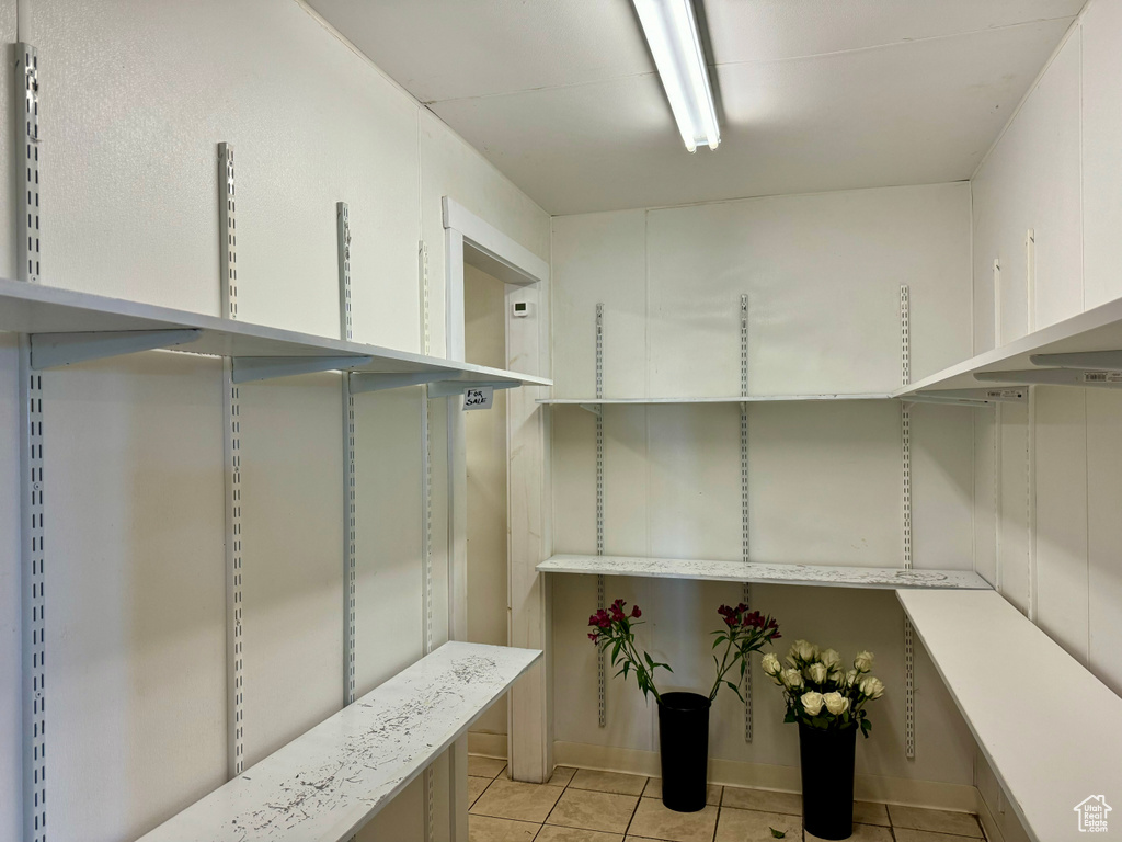 Spacious closet featuring light tile patterned floors