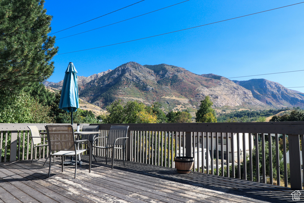 Wooden terrace featuring a mountain view