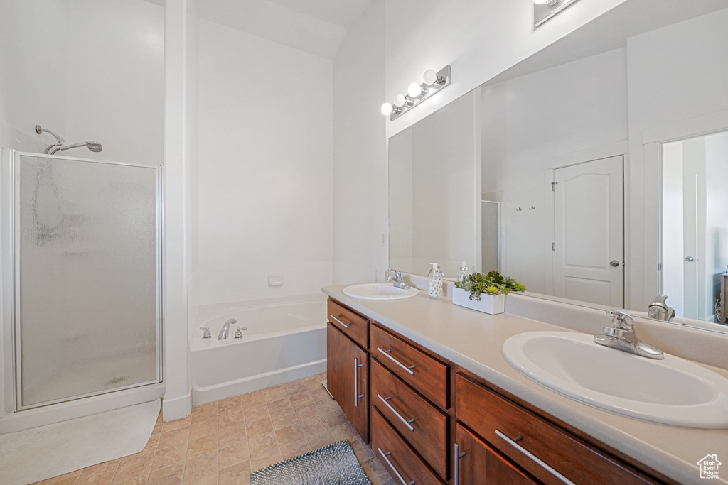 Bathroom with vanity and separate shower and tub