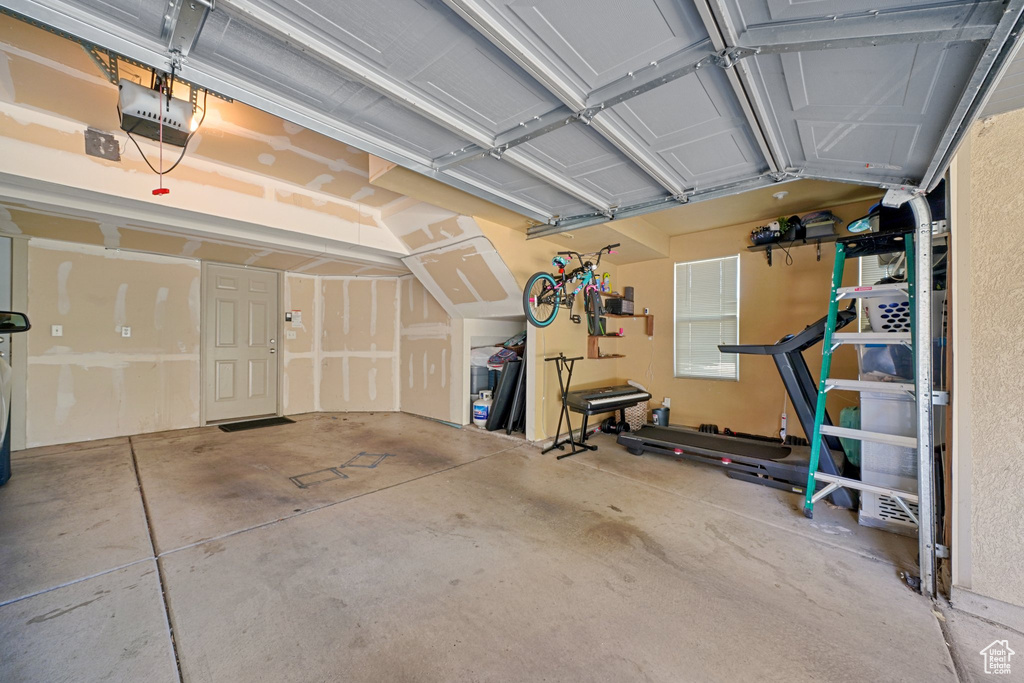 Garage featuring a garage door opener