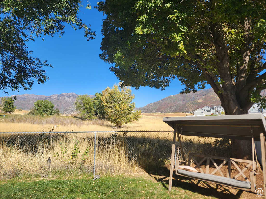 View of yard featuring a mountain view and a rural view