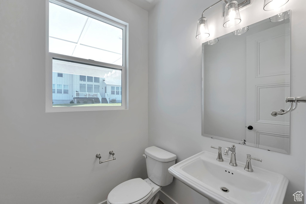 Bathroom featuring sink and toilet