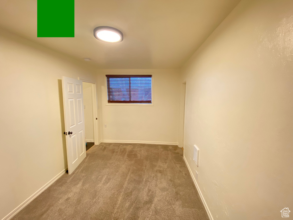 Unfurnished room with carpet floors