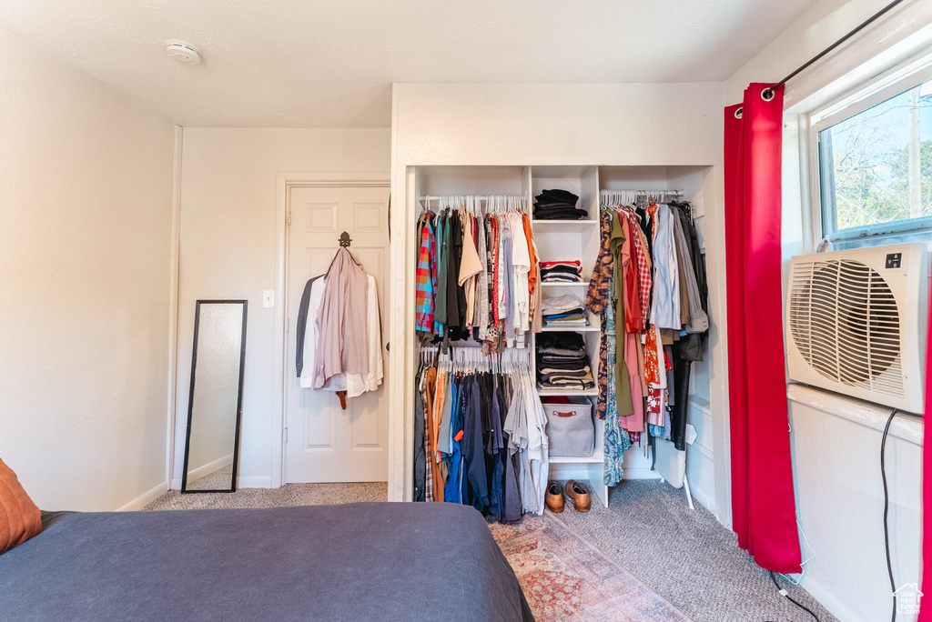 Carpeted bedroom featuring a closet