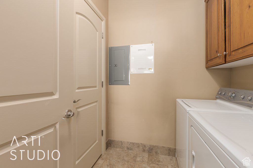 Clothes washing area with electric panel, independent washer and dryer, and cabinets