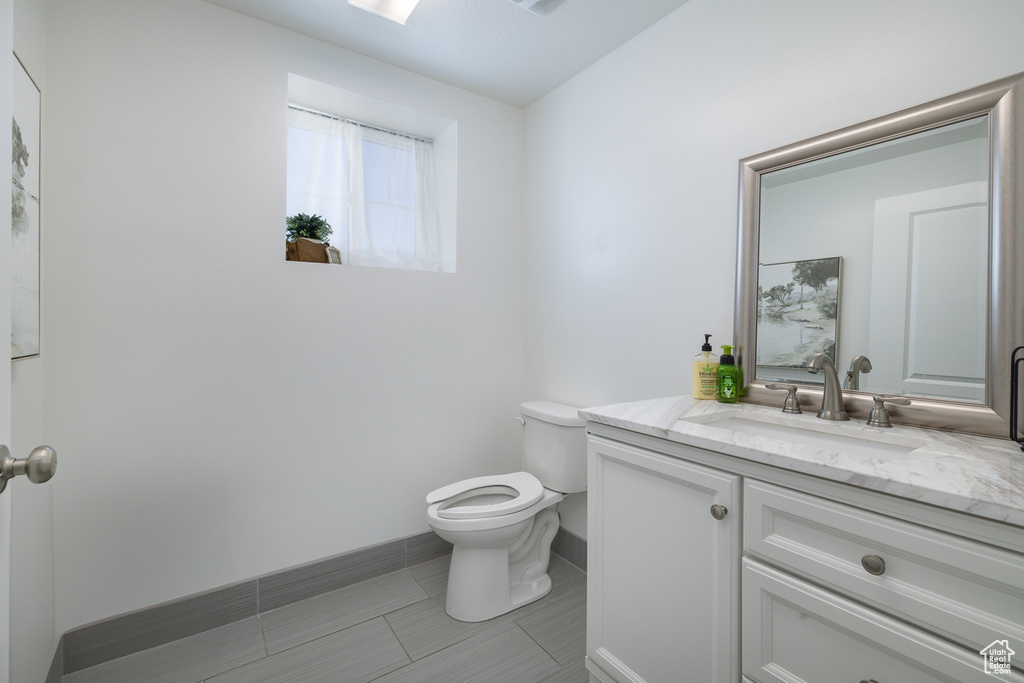 Bathroom with vanity and toilet