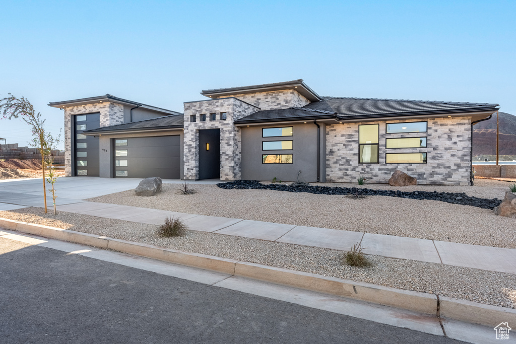 Prairie-style house featuring a garage