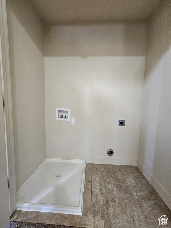 Clothes washing area featuring washer hookup and electric dryer hookup