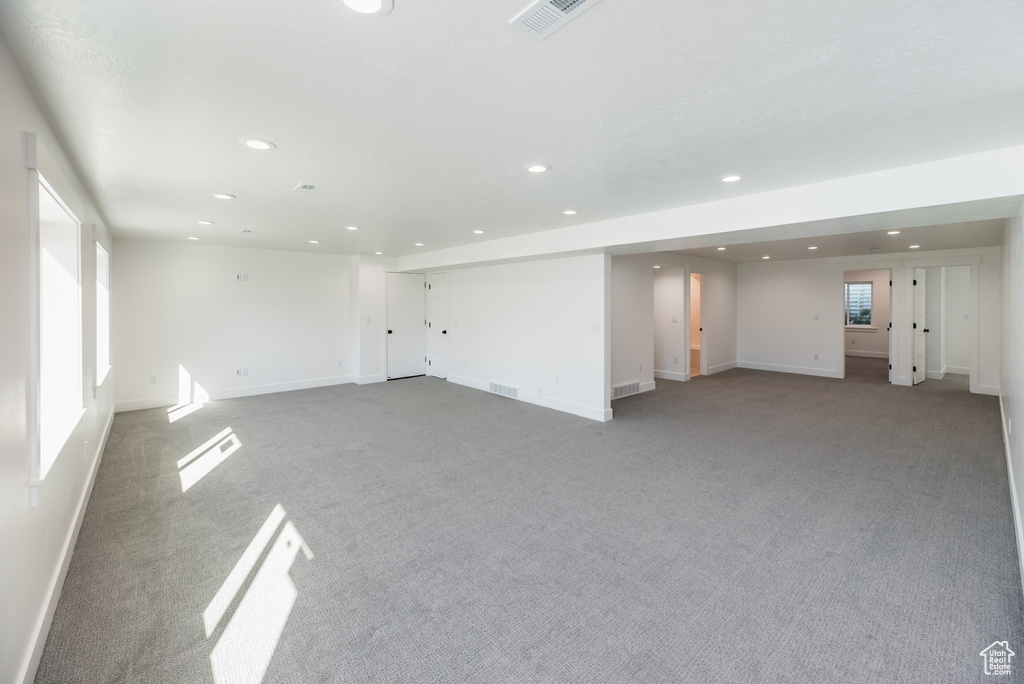 Spare room featuring light colored carpet