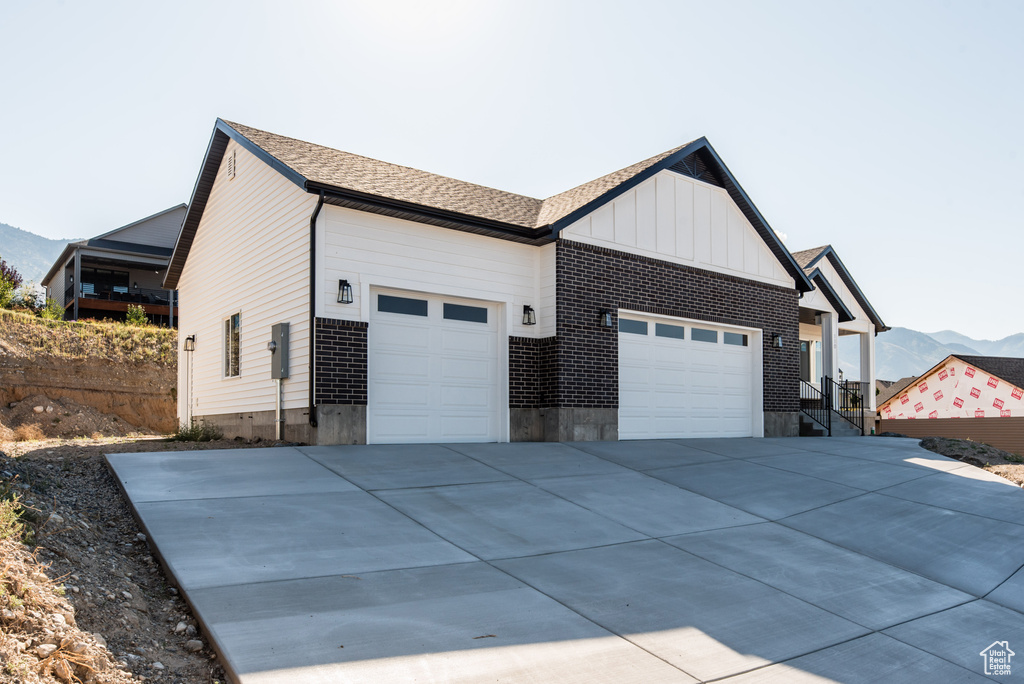 View of home\'s exterior featuring a mountain view and a garage