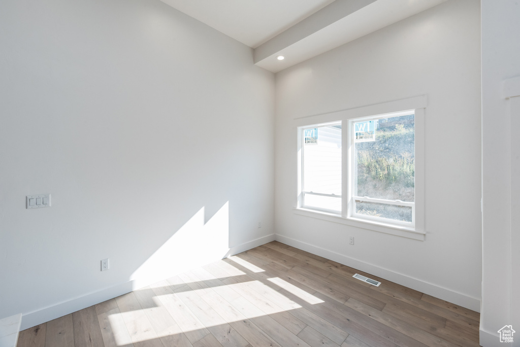 Spare room with light hardwood / wood-style floors