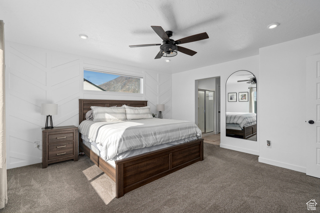 Bedroom featuring ceiling fan and carpet flooring