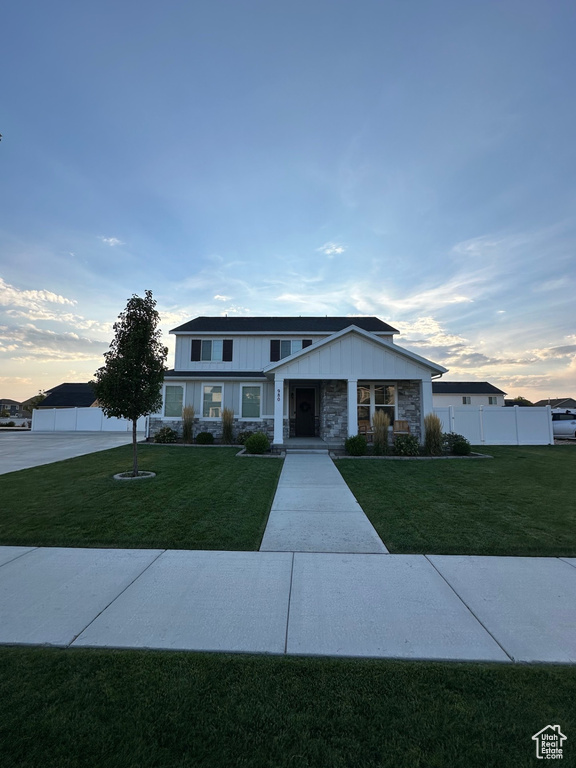 View of front of home with a yard