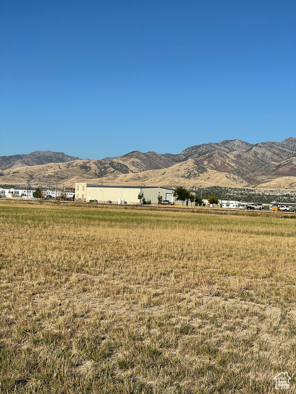 Property view of mountains with a rural view