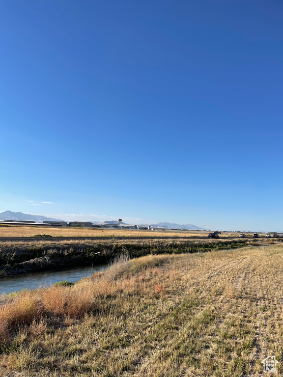 Exterior space featuring a water and mountain view and a rural view