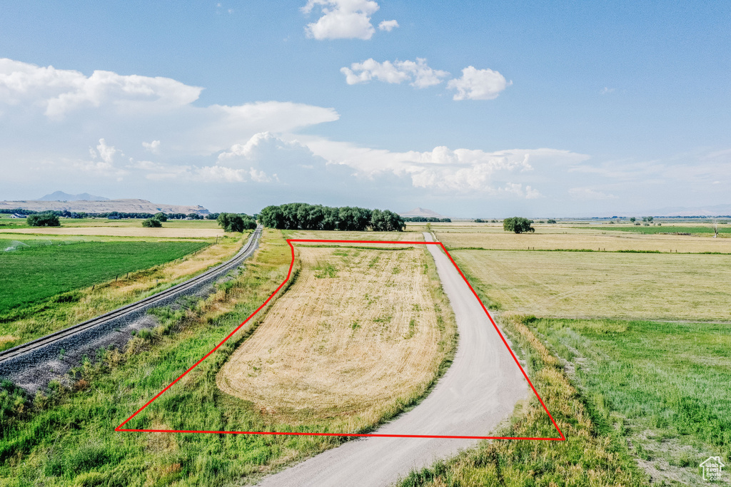 Birds eye view of property with a mountain view and a rural view