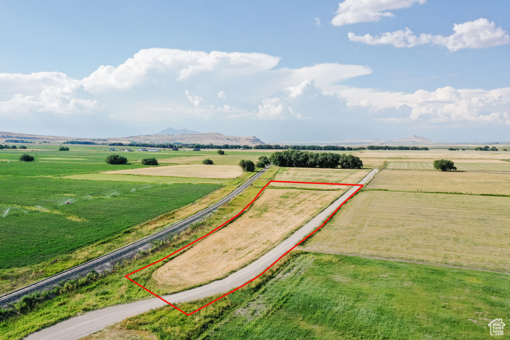 Aerial view featuring a rural view and a mountain view