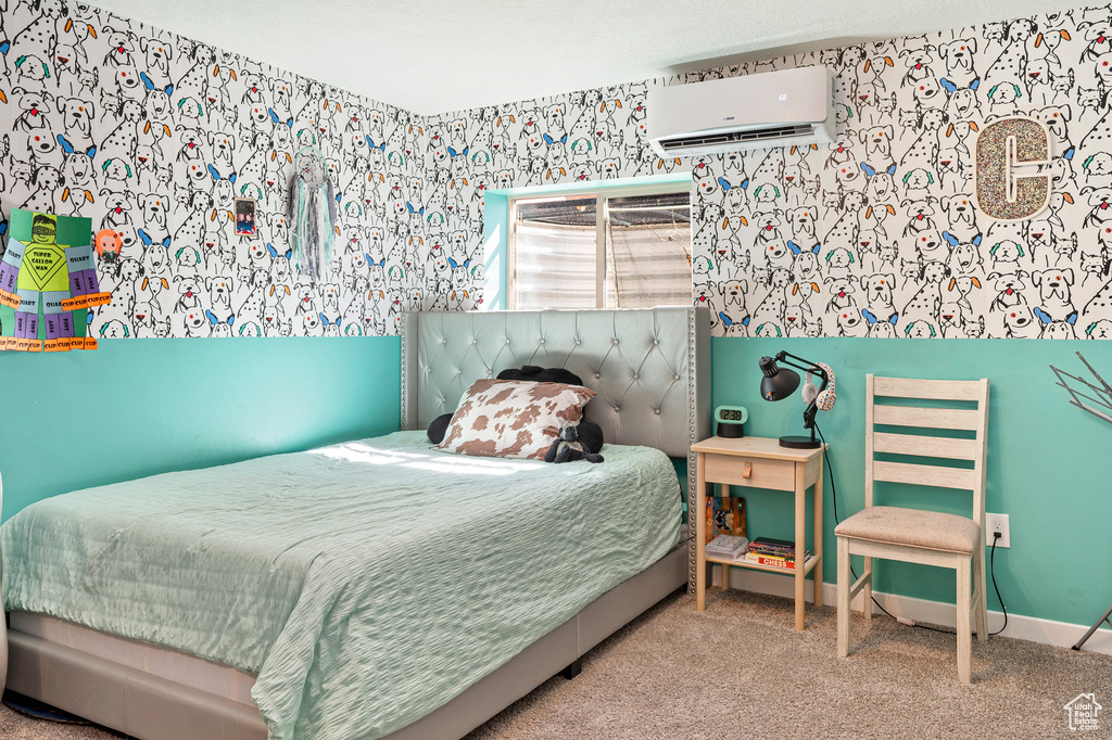 Bedroom featuring carpet and a wall mounted AC