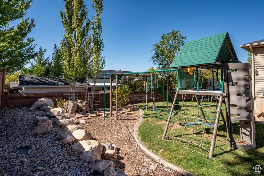 View of playground with a yard