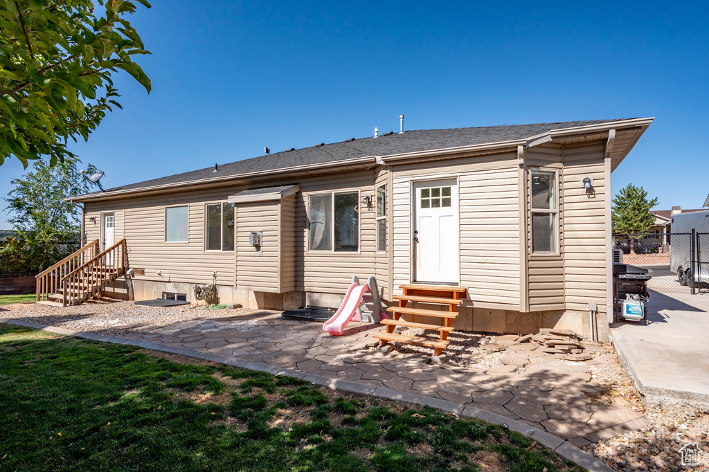 Rear view of property featuring a patio