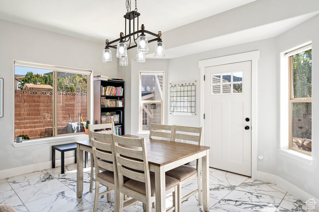 Dining room with a notable chandelier