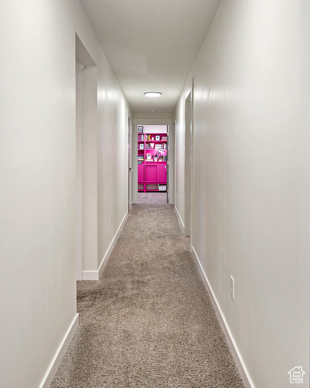 Corridor with carpet flooring